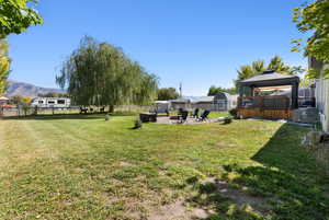 View of yard featuring a mountain view and a gazebo