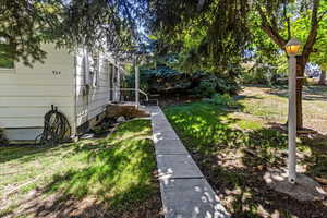 View of yard and front entry