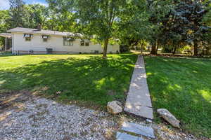 View of yard featuring shade trees