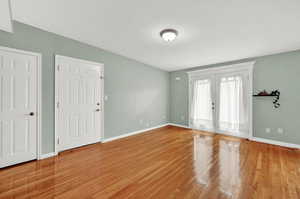 Living room featuring wood flooring and french doors