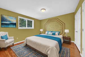 Bedroom featuring hardwood floors, Virtually Staged.