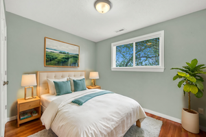 Bedroom with hardwood flooring, virtually Staged