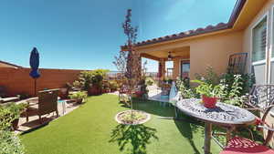 View of yard with a patio and ceiling fan