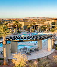 View of pool featuring a mountain view and a patio area