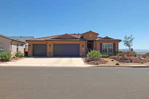 Mediterranean / spanish house with a garage