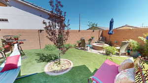 View of yard with a patio area and an outdoor fire pit