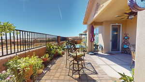 View of patio featuring ceiling fan