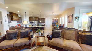 Tiled living room featuring an inviting chandelier