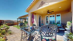 View of patio featuring ceiling fan