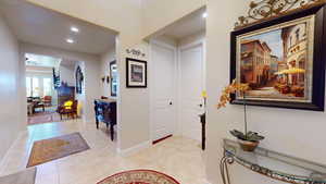 Entrance foyer with light tile patterned floors