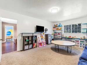 Bedroom #5 featuring light carpet flooring