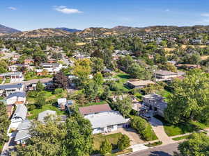 Birds eye view of property with a mountain view