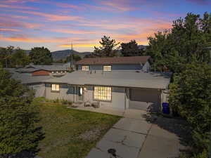 Front facade with a lawn and a mountain view