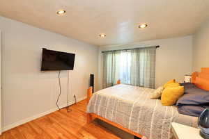 Bedroom featuring hardwood / wood-style flooring