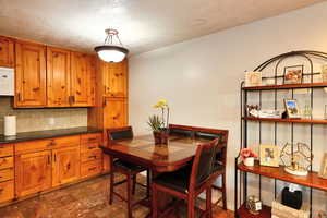 Dining room with a textured ceiling