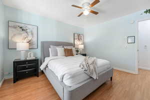 Bedroom featuring ceiling fan and light wood-type flooring