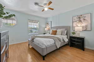 Bedroom featuring ceiling fan and light hardwood / wood-style floors