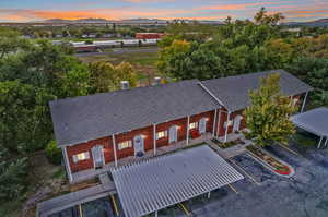 Aerial view at dusk featuring a mountain view