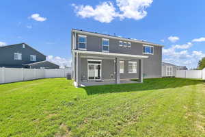 Rear view of house featuring a shed, a yard, a patio, and central air condition unit