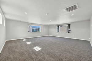 Unfurnished room with carpet flooring