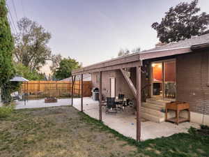 Exterior space with a patio and a fire pit