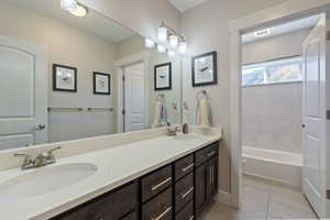 Bathroom featuring tile patterned flooring, vanity, and toilet