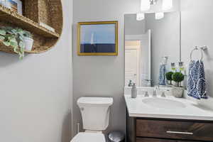 Bathroom featuring vanity and toilet