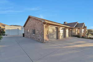 View of side of property featuring a garage