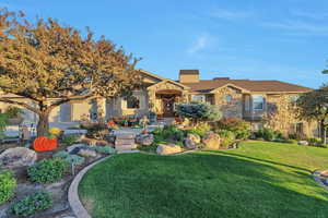 View of front of house featuring a front lawn