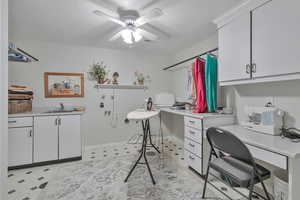 Office space featuring sink and ceiling fan