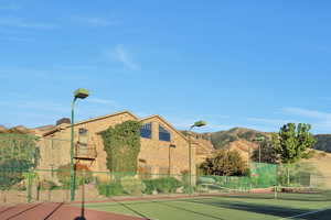 View of tennis court & pickleball court and basketball court with a mountain view