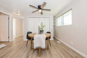 Dining room featuring light hardwood / wood-style flooring and ceiling fan