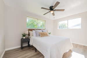 Bedroom with wood-type flooring and ceiling fan