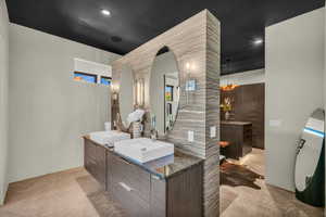 Bathroom with vanity and concrete flooring