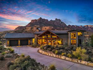 View of front of house with a garage and a mountain view