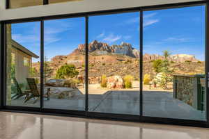 Doorway with concrete flooring and a mountain view