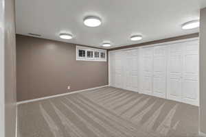 Unfurnished bedroom with multiple closets and carpet