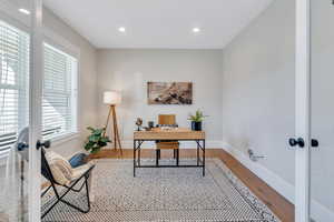 Office with french doors, hardwood / wood-style flooring, and a healthy amount of sunlight