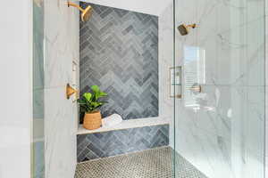 Primary bathroom with a tile shower