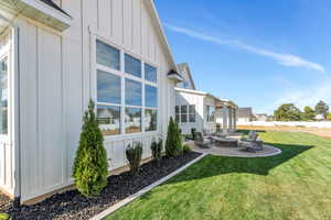 Exterior space featuring a patio, an outdoor fire pit, and a yard