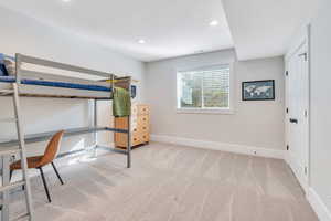 Carpeted bedroom with a textured ceiling