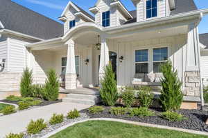 Cape cod-style house featuring a porch