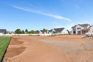 Unfinished yard has room for a future pool and/or pickleball court