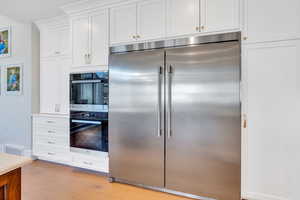 Industrial-sized refrigerator and double Miele ovens. One is a steam oven - great for baking!