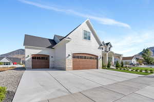 View of front of house featuring a garage and a mountain view