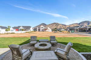 Backyard patio / terrace featuring a mountain view and a gas fire pit