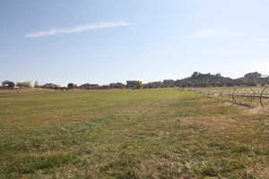 View of yard featuring a rural view and wheel lines