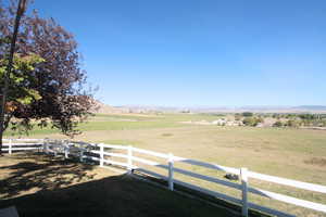 View of yard with a rural view