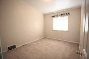 Bedroom 2 featuring lofted ceiling