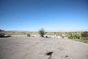 View of street with a rural view and a mountain view